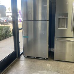 Stainless steel Frigidaire refrigerator with top freezer XB