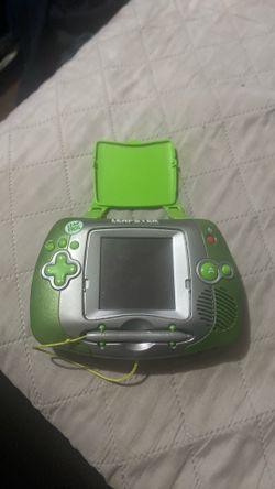 green and silver LeapFrog Leapster Learning Game System