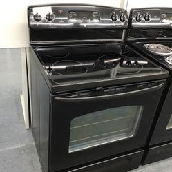 GE 4 Burner Glass Top Black Range. 1 year Warranty 