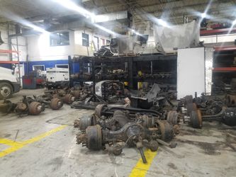 Lot of Freightliner Cascadia Volvo VNL Engine body parts fuel tanks axles