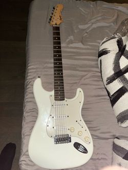 Squier Bullet Strat with Tremolo Arctic White guitar.