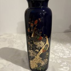 vintage Japanese cobalt blue porcelain vase featuring a peacock and cherry blossom motif