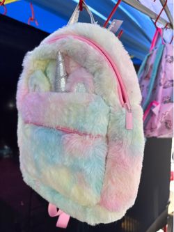 Little girl backpacks