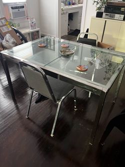 silver and glass extendable dining table