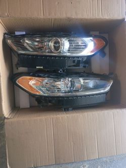 2013 through 2016 Ford fusion left and right headlights assemblies brand new in the box