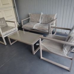 Outdoor patio couch with chairs and coffee table 