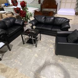 Beautiful three-piece black leather Sofa set