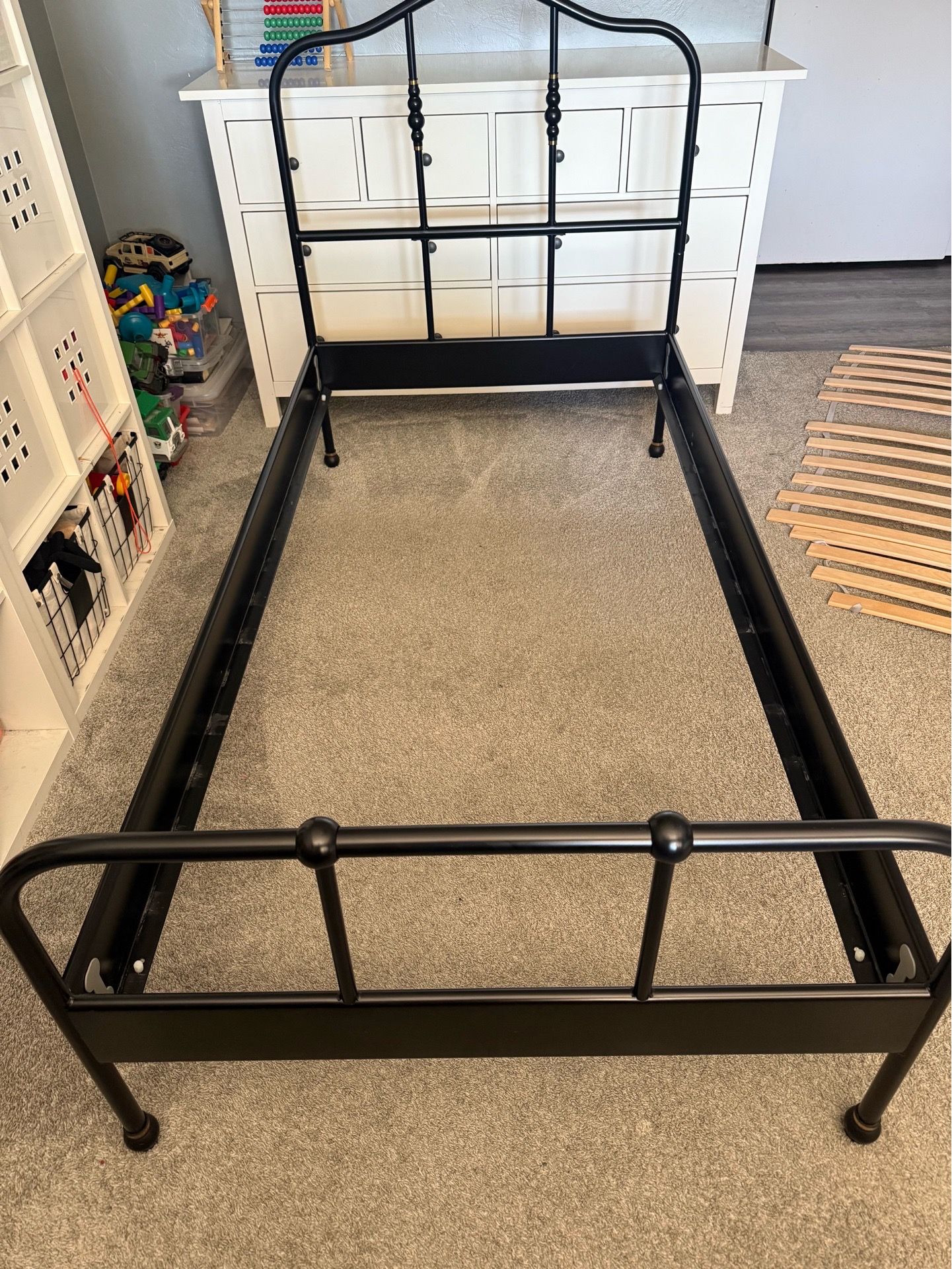 Black IKEA metal twin bed