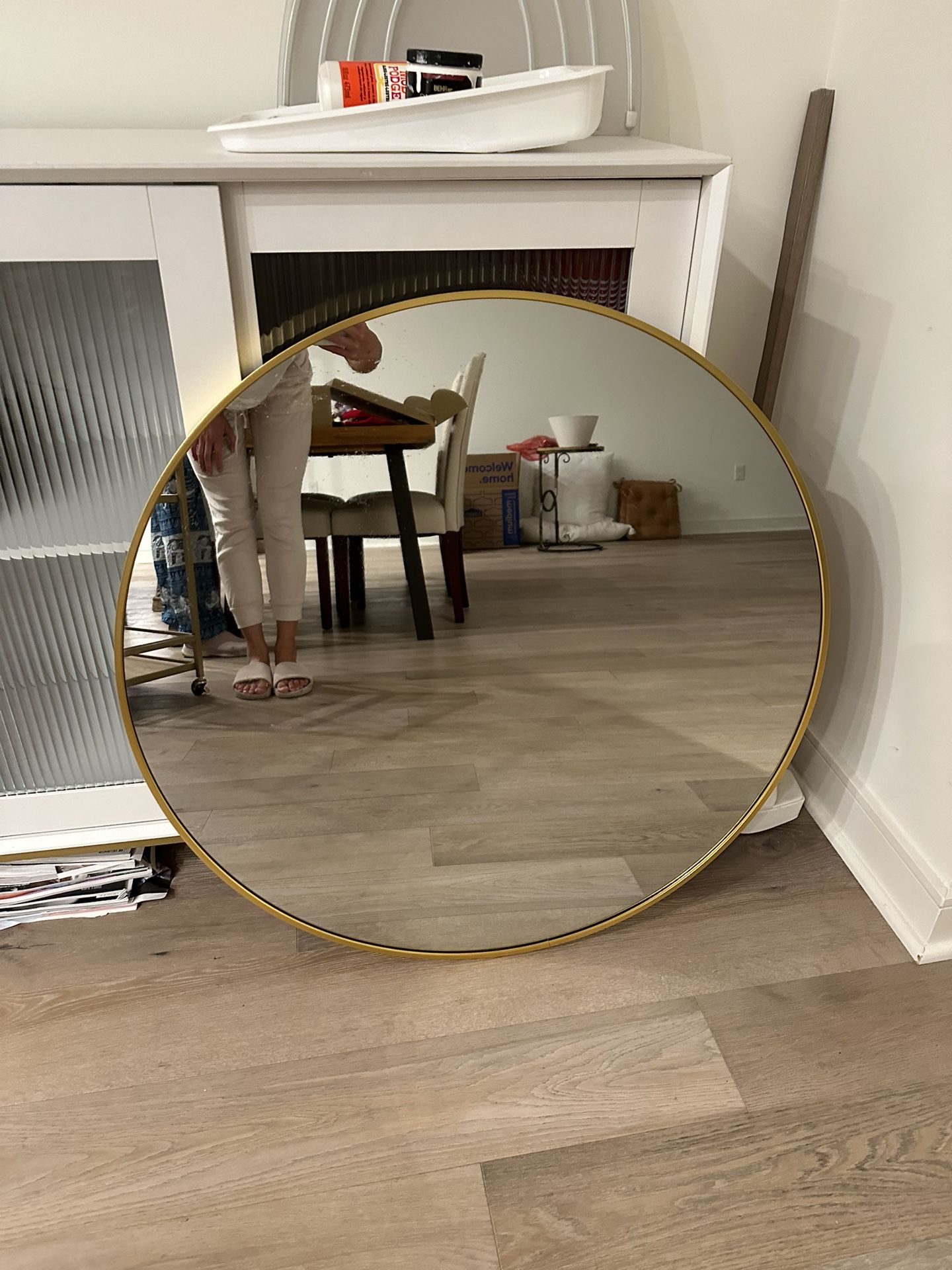 Gold rimmed wall mirror