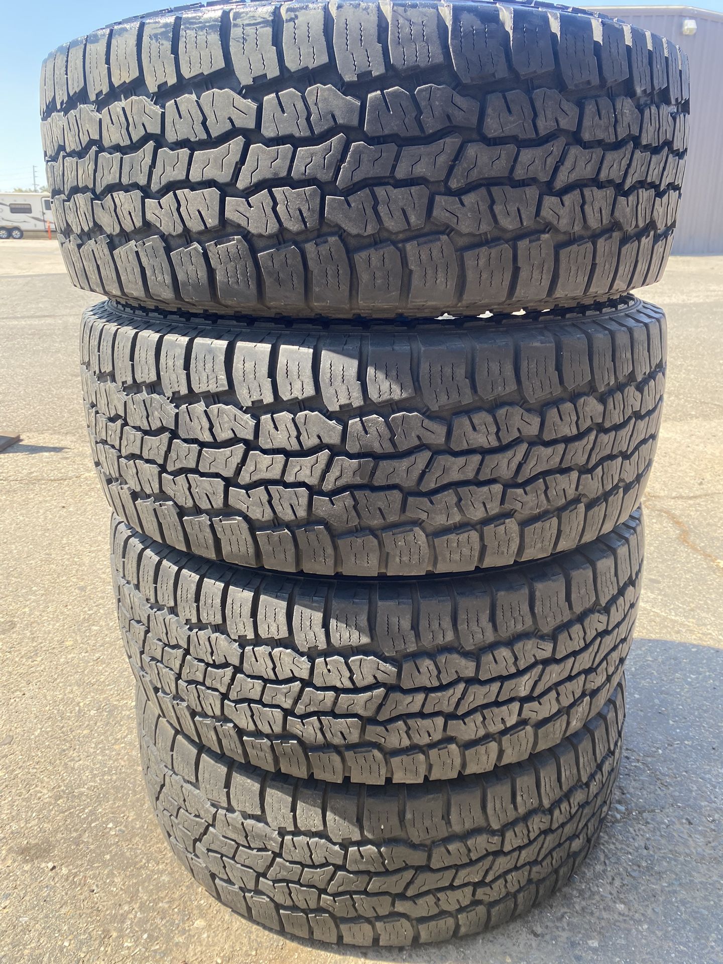 (4) Open Range 285/70LT17 AT tires ~ 10 ply ~ 80% tread