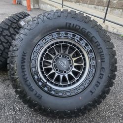 17" LOCK brand rims w- 33" Ridgecrawler RT tires. 