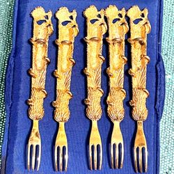 This is a Lot of 5 Gold Tone delicacy forks.