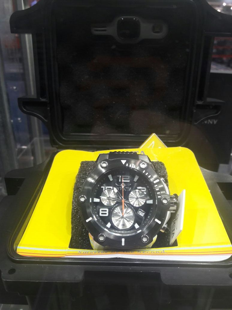 Men's Invicta Watch new in box retails for over 335.oo