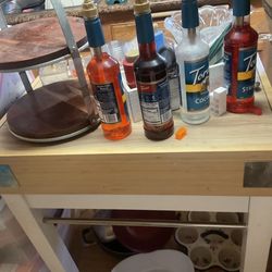 Kitchen island has a lot of storage and a drawer that pulls out