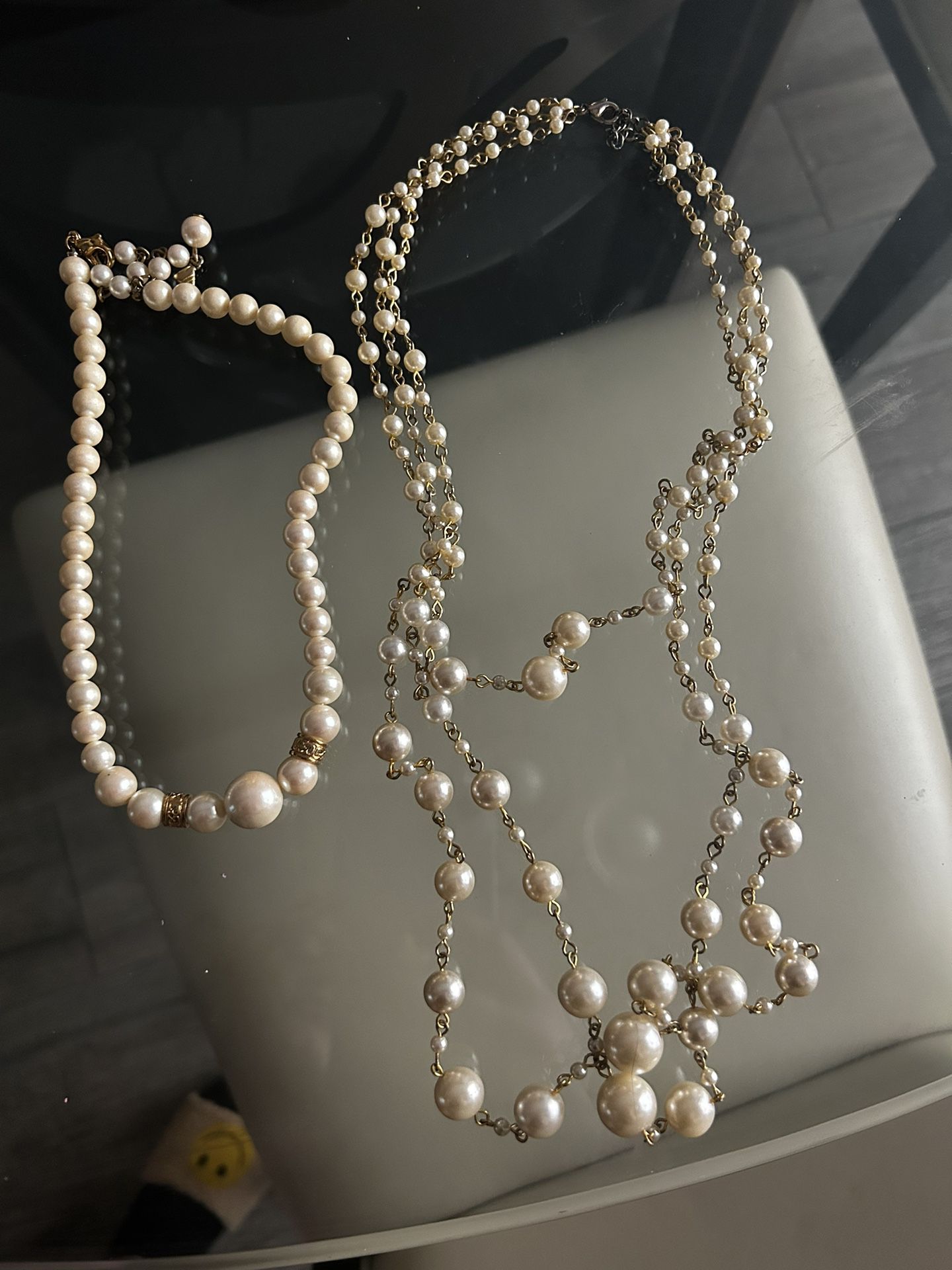 Pearl Necklaces Along With Set Of Pearl Earnings.