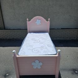Pink twin-size bed frame with brand-new Twin size mattress with bunkie board in plastics