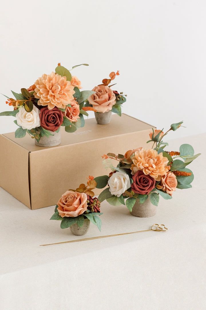 11 Ling’s Moments centerpieces in Sunset Terracotta