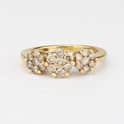 10k Diamond Ring Champagne Cluster Ring approx. 1 cwt. Stamped 10k Size 7 weight is 3 grams. Jewelry Mark is<KJP> 1 3mm diamond surrounded by 6 2.5mm 