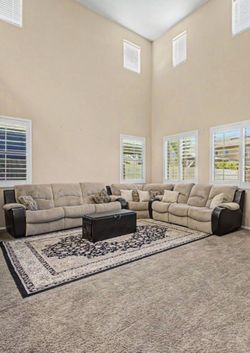 Sectional, rug, and ottoman