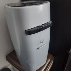 Cat Genie and two litter genie refills.