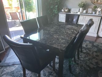 Faux black marble table with 6 vinyl leather chairs