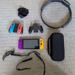 Nintendo Switch with case, 128 GB Micro SD Card, 2 sets of Joycons, 4 games, and Ring Fit Ring and Strap