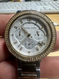 two-tone Michael Kors Parker MK5626 chronograph watch featuring a crystal-studded gold bezel and a textured silver dial