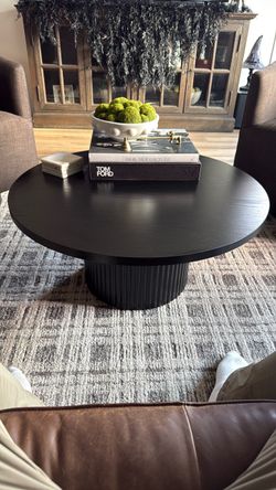Round Black Coffee Table with Fluted Pedestal Base