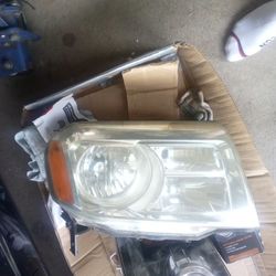 Both Right Headlights One For The F-150 And Other For Honda Pilot