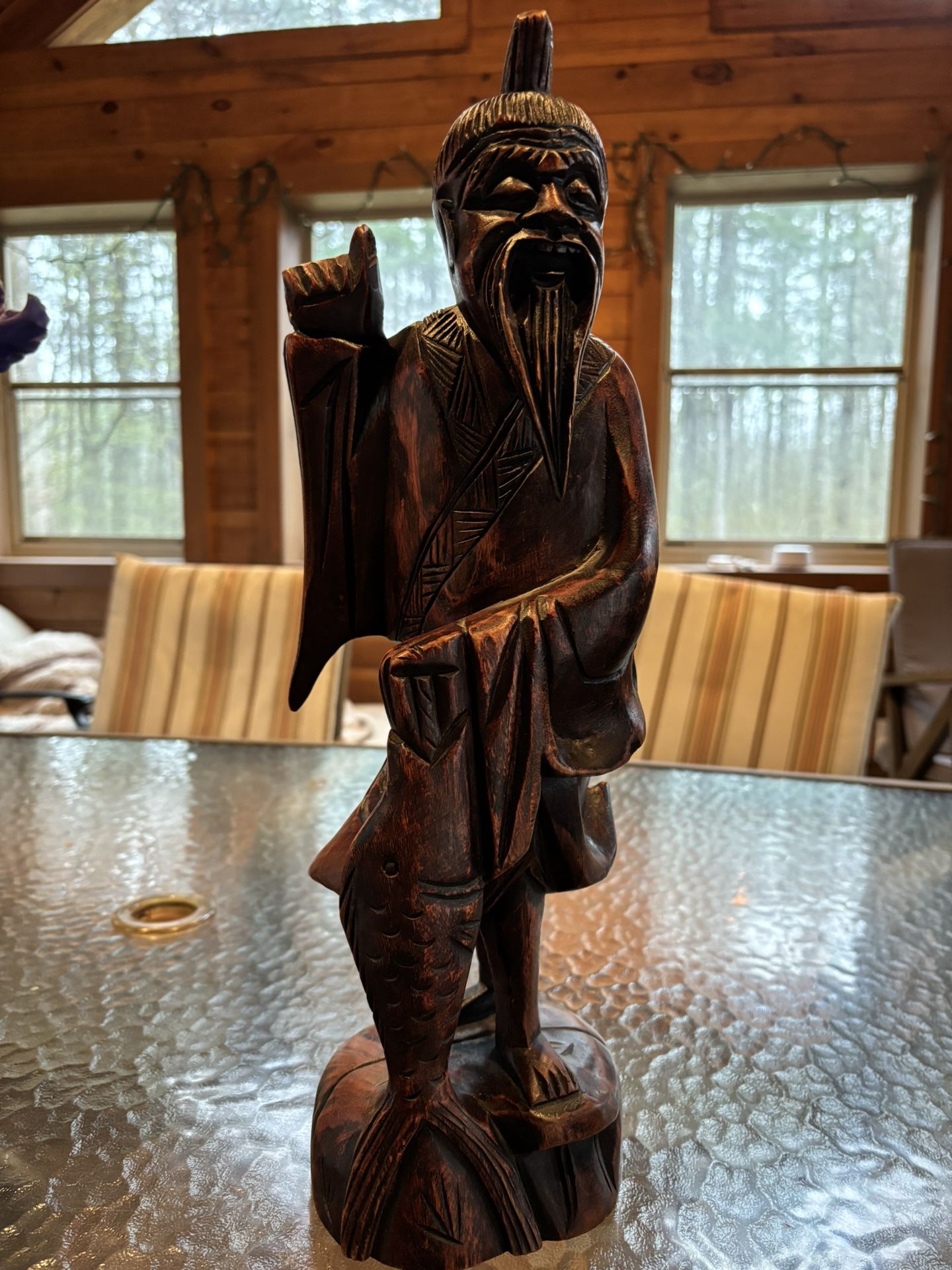 Wood carving oriental figurine