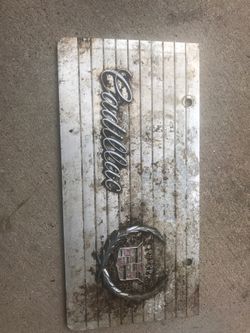 Old Cadillac plate . Chrome