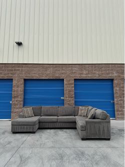 Ashley’s grey Sectional sofa couch with chaise
