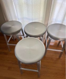 2 CB Crate & Barrel Swiveling Stools in Brushed Aluminum
