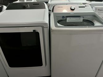 Samsung (5.4 cu.ft.) Top load washer and (7.4cu.ft.) electric dryer laundry pair.
