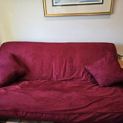 Queensize Hidabed With All Red Cover And Pillows