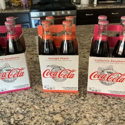 Coke, Raspberry and Peach glass bottles