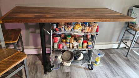 Solid Hardwood table with 3 matching Bar Chairs.