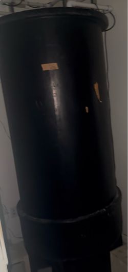 large black polyethylene vertical storage/reservoir tank