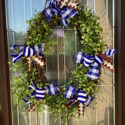 Oval Wreath with football ribbons 23” x 18”