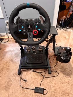 Logitech G29 racing wheel with pedals, H shifter and folding stand.