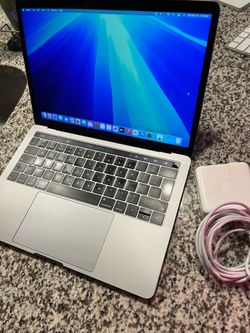 2019 MacBook Pro Touch Bar 13-inch Four thunderbolt 2.3 GHz quad core i5 processor 8gb ram 500gb ssd with charger. Works great