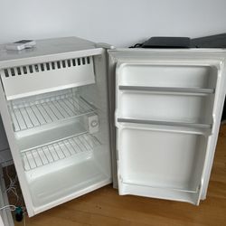 Working white mini fridge