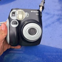 A Polaroid camera 300