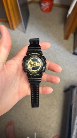 Black and gold G Shock watch