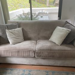 Used cream colored couch and loveseat and ottoman