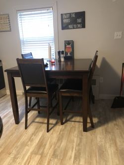 Pub table with to chairs and a bench $350