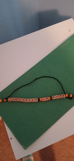 BRAND NEW "HALLOWEEN IS HERE " DECORATION, WOODEN BEADS WITH ORANGE AND BLACK PLASTIC BEADS