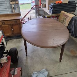Vintage/antique Drop Leaf Table soild wood great  finish  oval  shape i think it's cherry or mahogany in excellent condition solid and finish