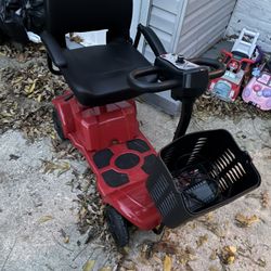  a four-wheel electric mobility scooter. 