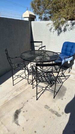Metal table plus chairs
